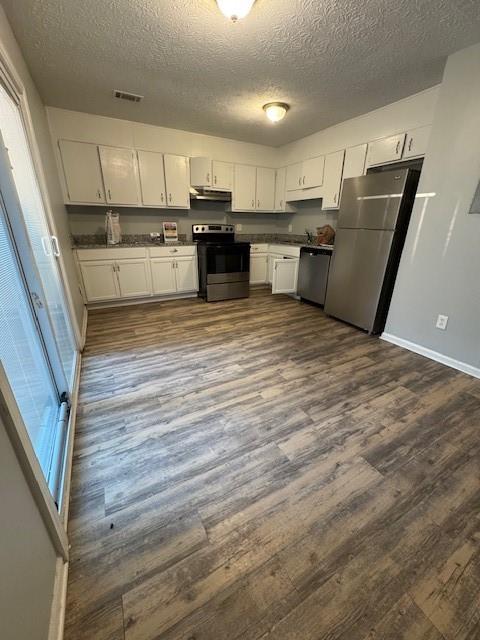8327 Glenwoods Terrace, Unit A Riverdale, GA 30274 - Photo 7 of 9 a view of kitchen with wooden floor