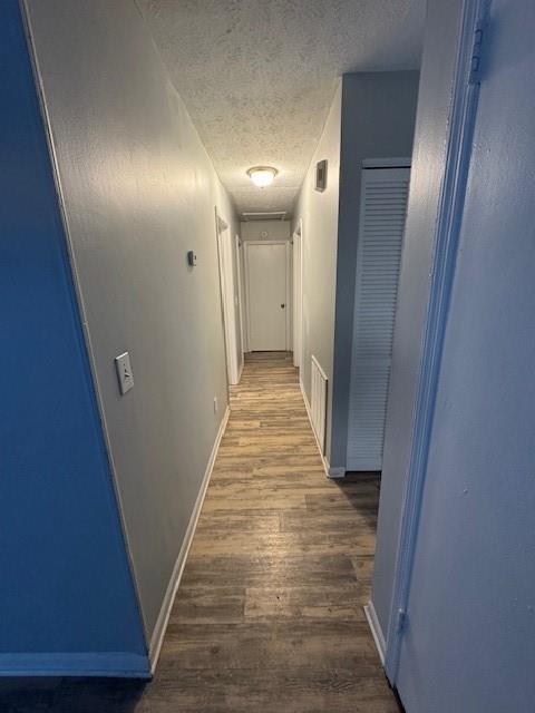 8327 Glenwoods Terrace, Unit A Riverdale, GA 30274 - Photo 8 of 9 a view of a hallway with wooden floor and staircase