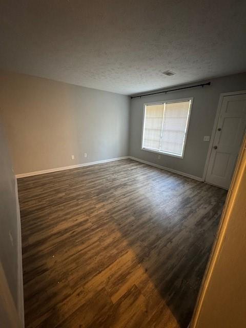 8327 Glenwoods Terrace, Unit A Riverdale, GA 30274 - Photo 9 of 9 a view of an empty room with wooden floor and a window