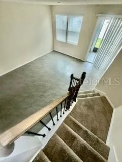 a view of balcony with furniture