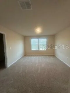a bathroom with a granite countertop sink mirror and toilet