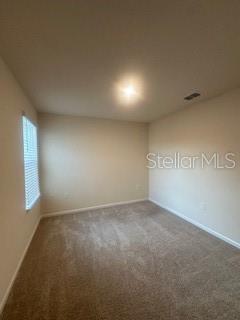 163 Redbud Road Palm Coast, FL 32137 - Photo 21 of 29 an empty room with windows