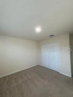 a view of an empty room with a large window