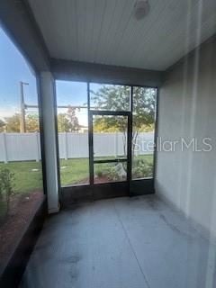 163 Redbud Road Palm Coast, FL 32137 - Photo 26 of 29 an empty room with large windows