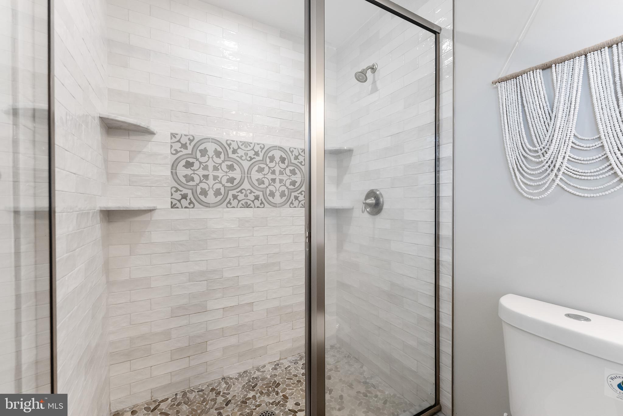 12 Lighthouse Drive, Unit A Brigantine, NJ 08203 - Photo 20 of 32 a bathroom with a shower and a toilet