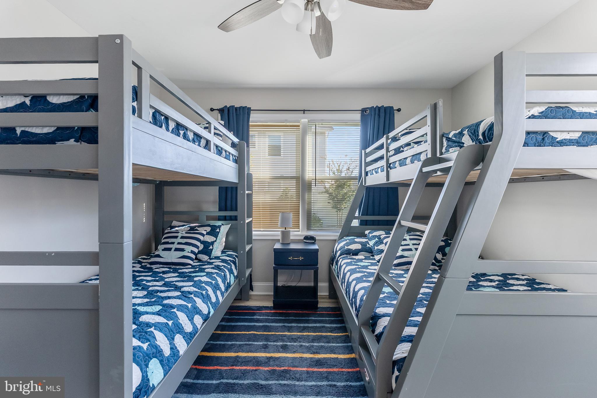 12 Lighthouse Drive, Unit A Brigantine, NJ 08203 - Photo 22 of 32 a bedroom with furniture and a wooden floor