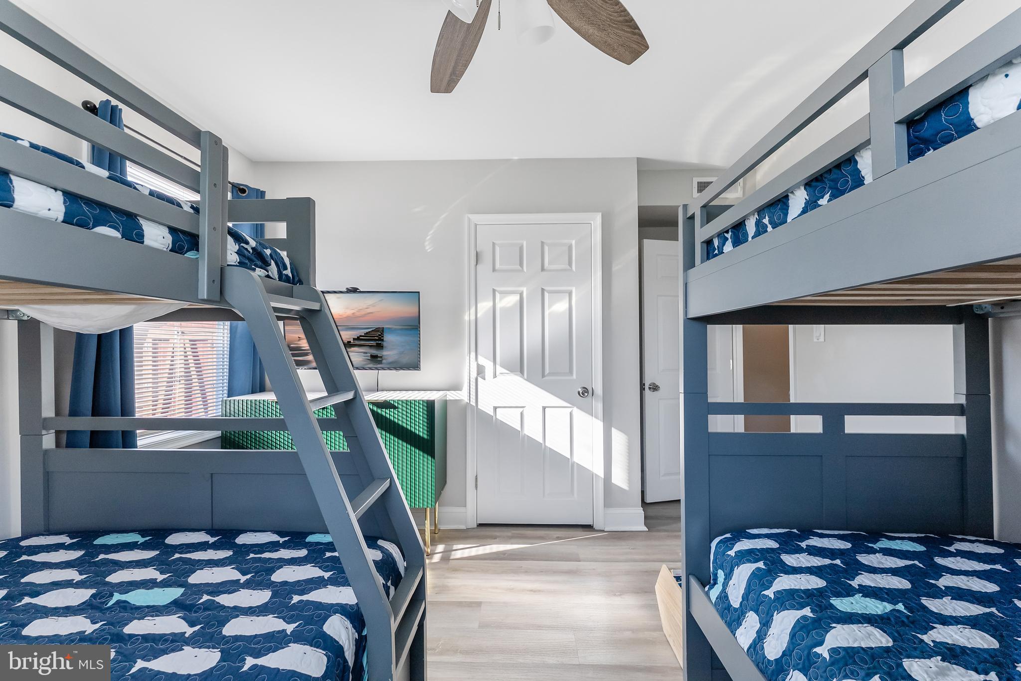 12 Lighthouse Drive, Unit A Brigantine, NJ 08203 - Photo 23 of 32 a bedroom with furniture and a window