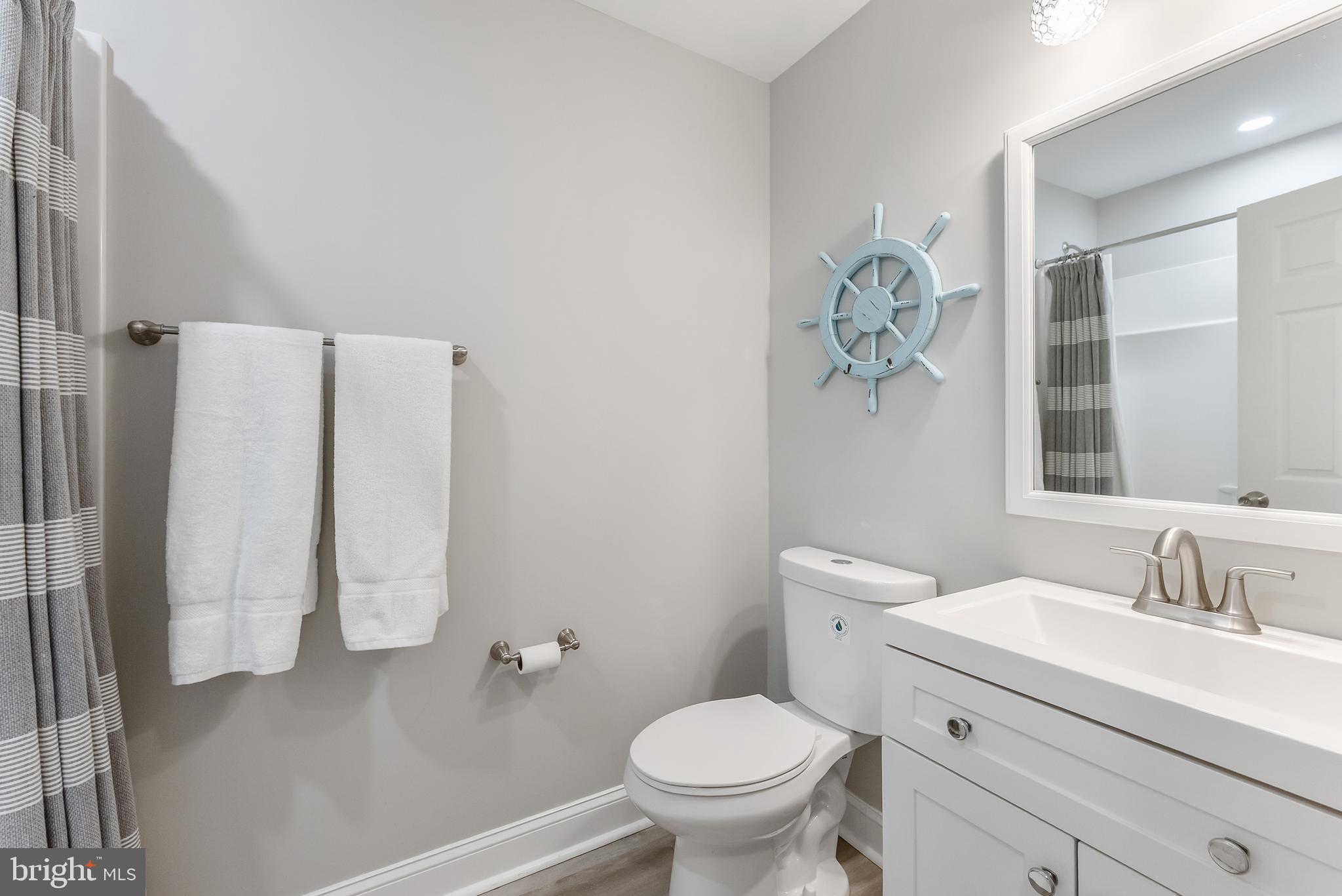 12 Lighthouse Drive, Unit A Brigantine, NJ 08203 - Photo 25 of 32 a bathroom with a sink toilet and shower