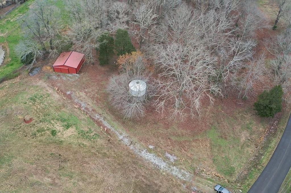 1486 Cedar Grove Road Big Sandy, TN 38221 - Photo 15 of 16 a view of a backyard