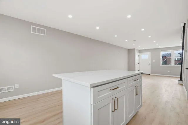a kitchen with white cabinets