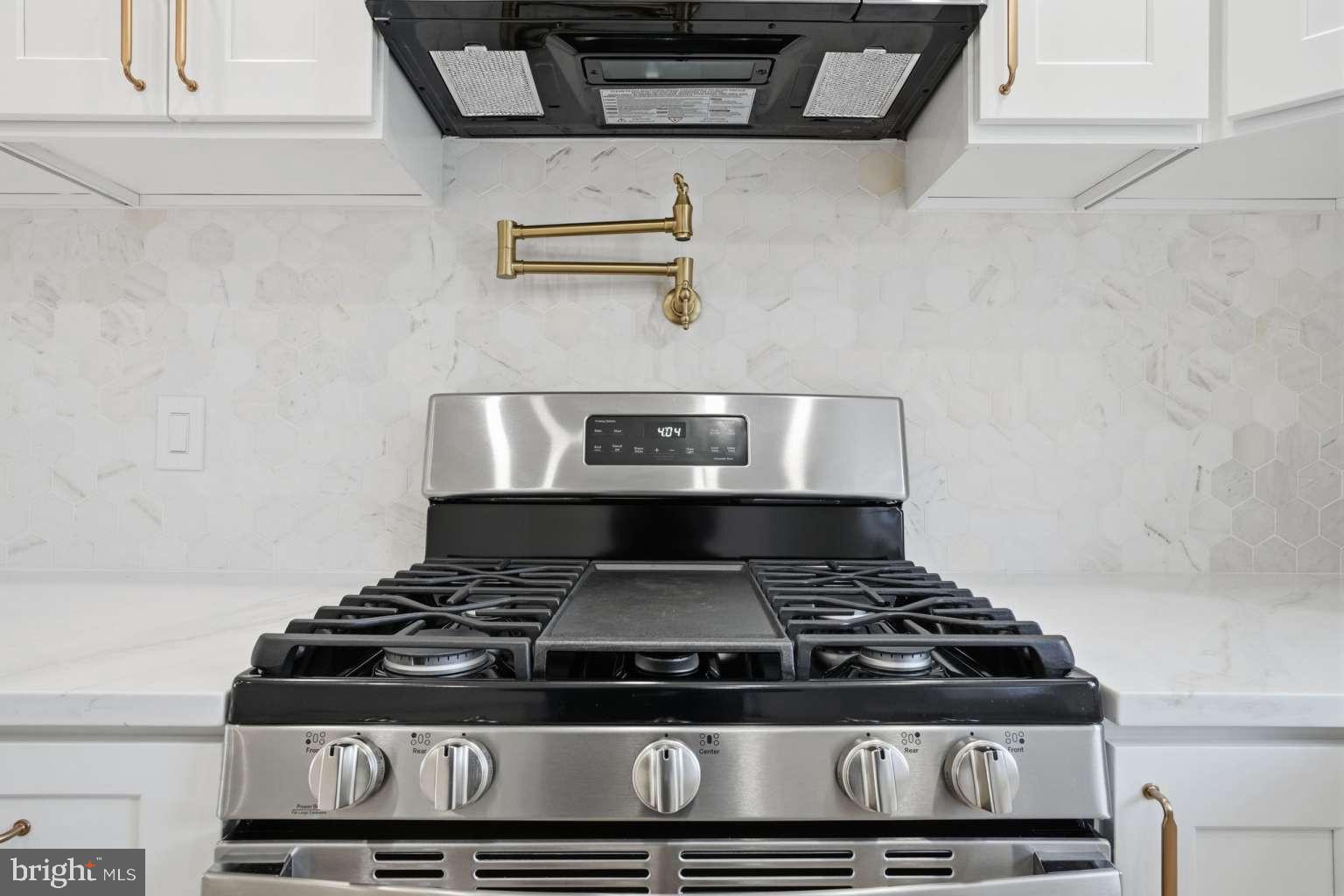 8653 Rugby Street Philadelphia, PA 19150 - Photo 17 of 45 a stove sitting inside of a kitchen