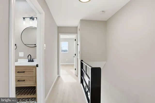 a bedroom with a large bed and a flat screen tv