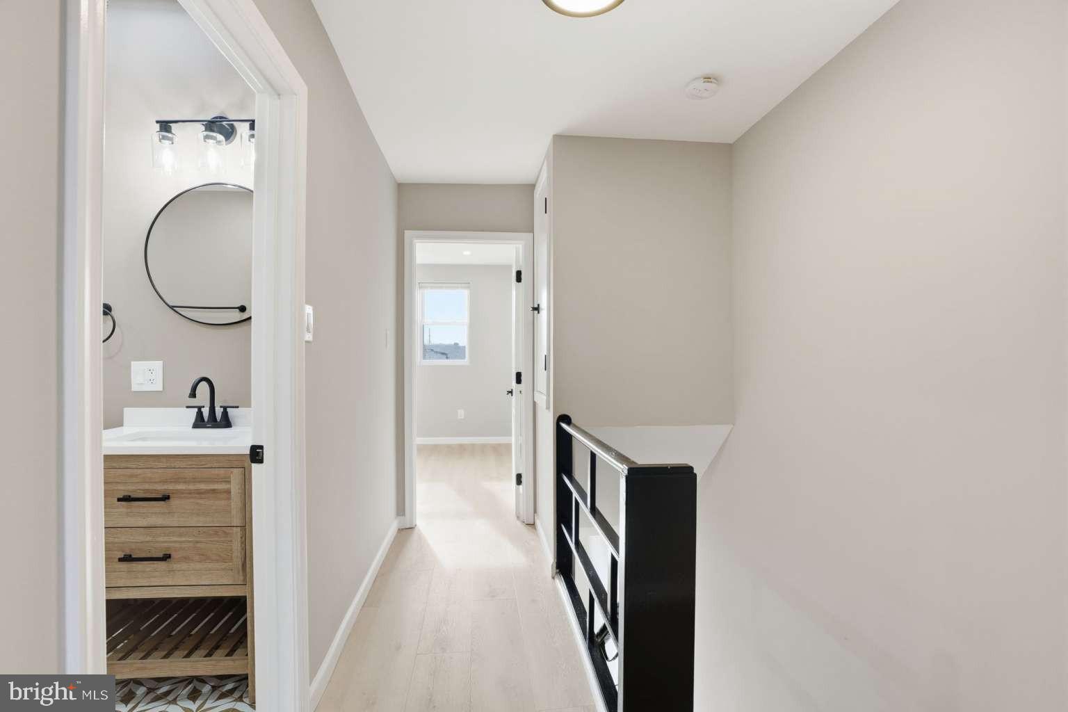 8653 Rugby Street Philadelphia, PA 19150 - Photo 20 of 45 a view of a hallway with wooden floor and cabinet