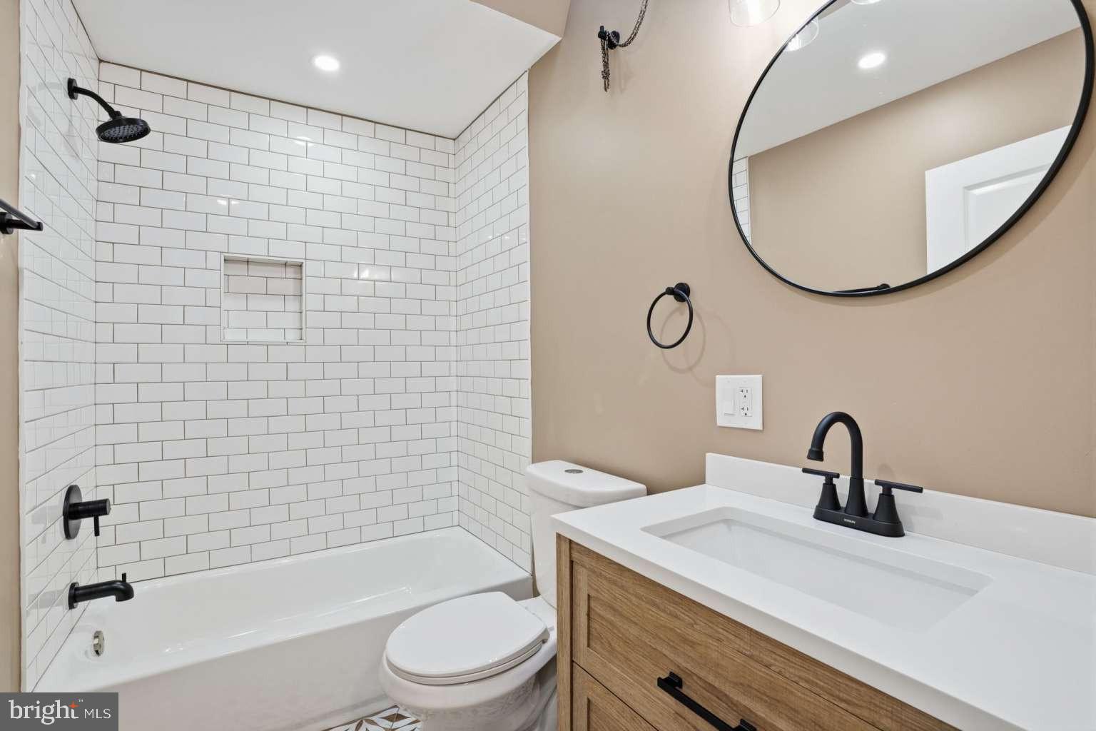 8653 Rugby Street Philadelphia, PA 19150 - Photo 30 of 45 a bathroom with a sink a toilet and shower