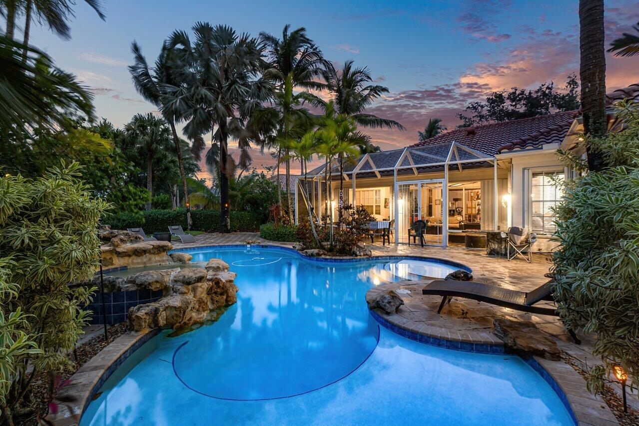 7580 Red River Road West Palm Beach, FL 33411 - Photo 60 of 69 a view of a swimming pool and lounge chair