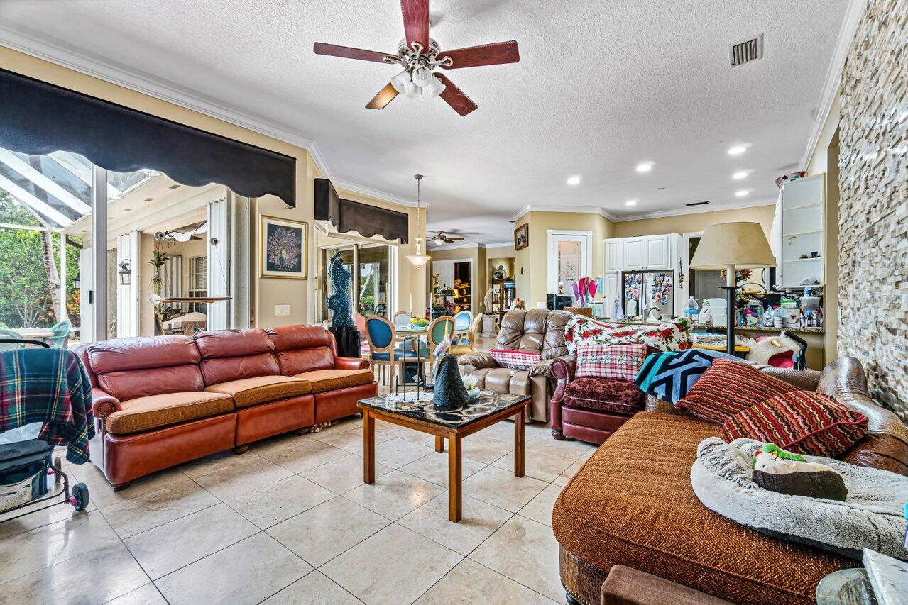 7580 Red River Road West Palm Beach, FL 33411 - Photo 8 of 69 a living room with furniture kitchen view and a large window