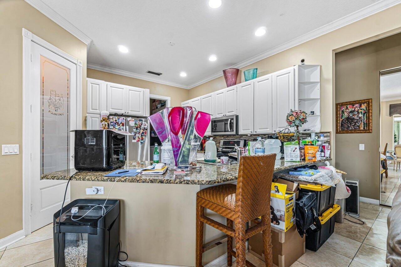 7580 Red River Road West Palm Beach, FL 33411 - Photo 10 of 69 a room with furniture and a flat screen tv