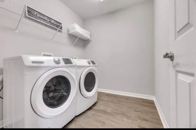 a utility room with dryer and washer