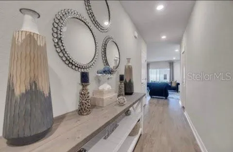 a large room with a large window and chandelier