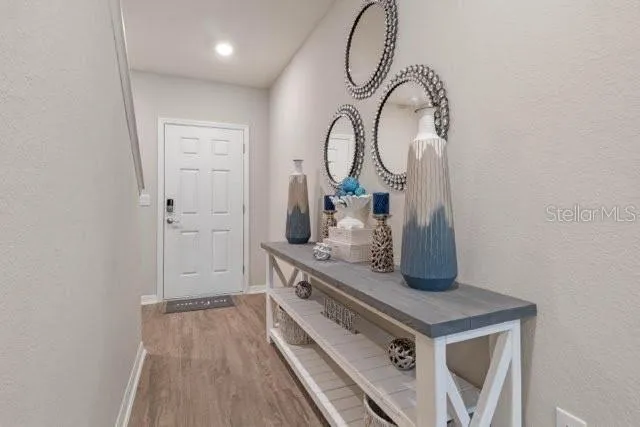 a room with a sink and a mirror