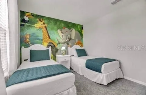 a bedroom with a bed and window