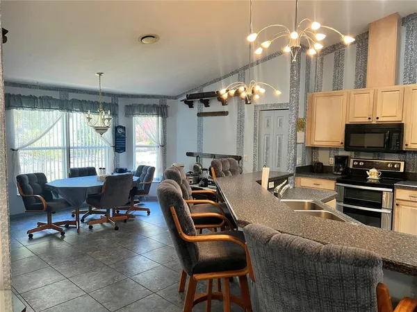 a view of a livingroom with furniture and a chandelier