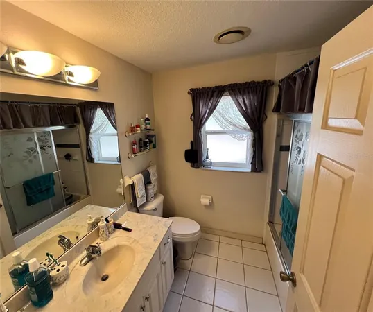 a bedroom with a bed furniture and a window