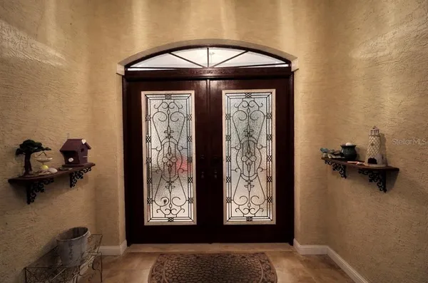 a view of front door with a bench