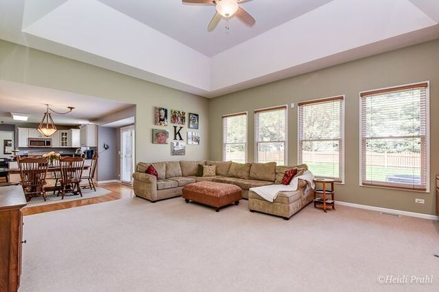 2107 Wicklow Road Naperville, IL 60564 - Photo 11 of 27 a living room with furniture and a large window
