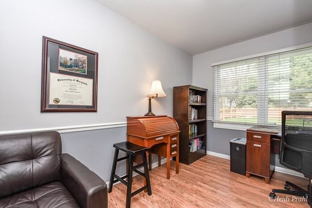 2107 Wicklow Road Naperville, IL 60564 - Photo 12 of 27 a living room with furniture and a window