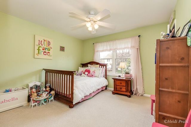 2107 Wicklow Road Naperville, IL 60564 - Photo 17 of 27 a bedroom with furniture and a window