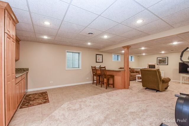 2107 Wicklow Road Naperville, IL 60564 - Photo 21 of 27 a view of a livingroom with furniture and a window