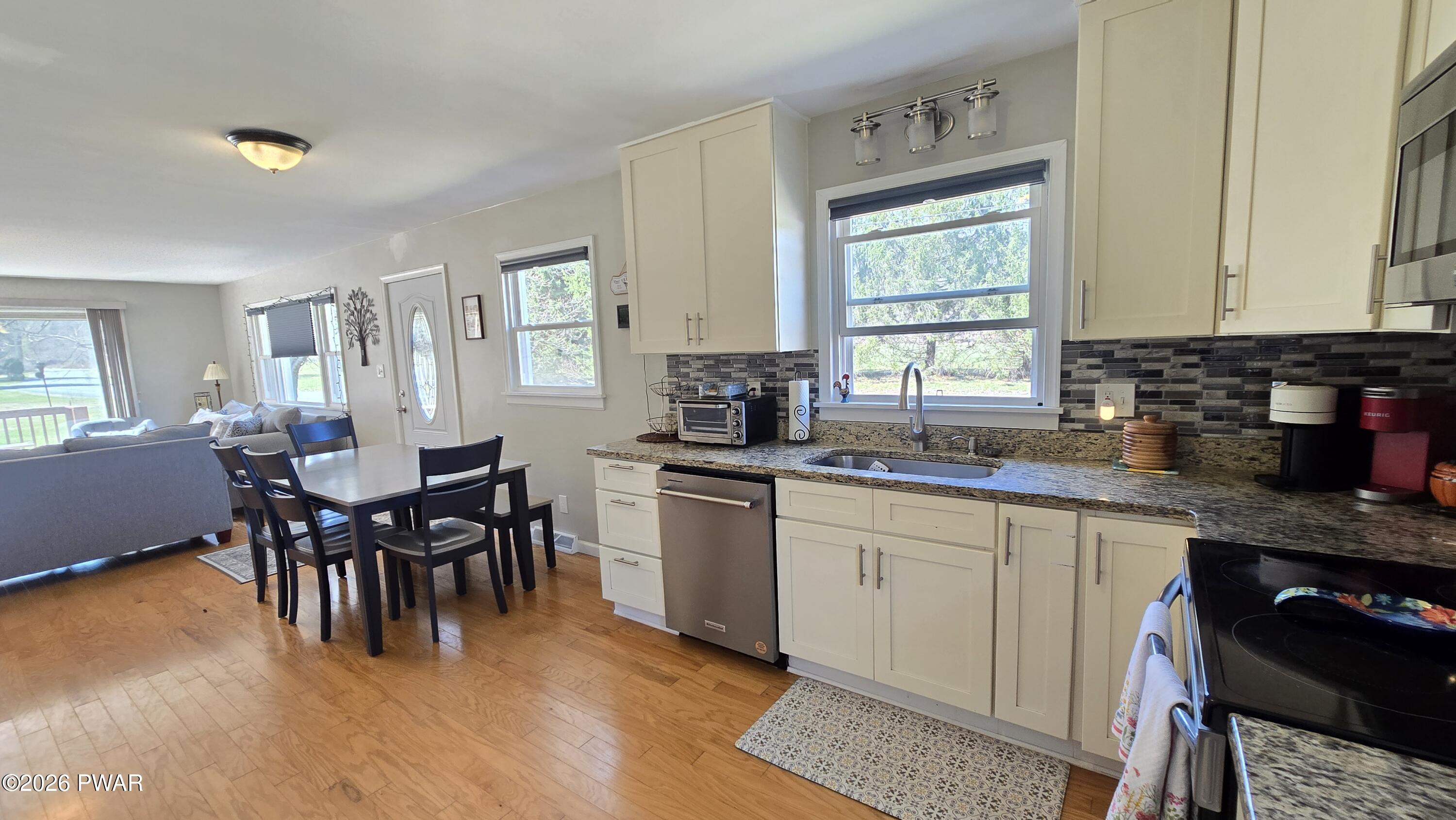 430 Griffith Road Tyler Hill, PA 18469 - Photo 6 of 31 a kitchen with a dining table chairs and window