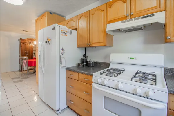 a kitchen with a cabinets and appliances