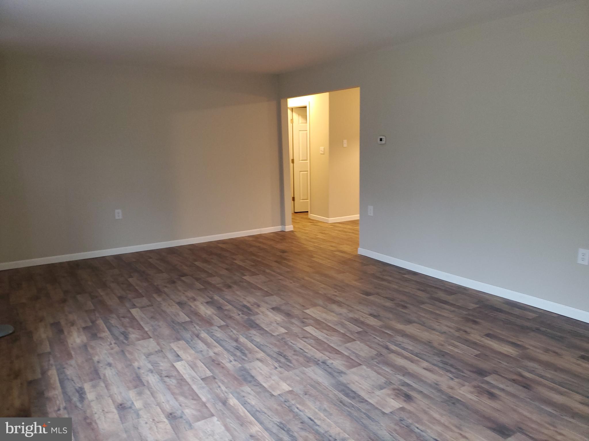 24868 Pinetown Road Denton, MD 21629 - Photo 5 of 26 Living Room To Hallway