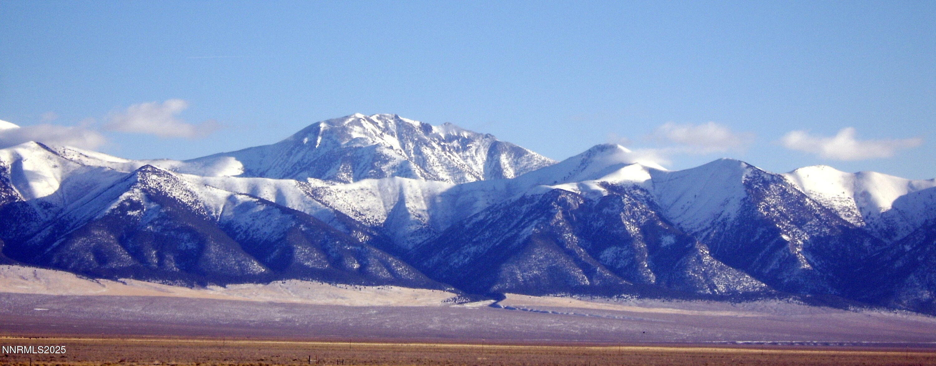 6645 Antelope Circle, Unit 649003 Austin, NV 89310 - Photo 6 of 9 a view of a house with a yard