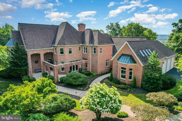 an aerial view of residential houses with yard