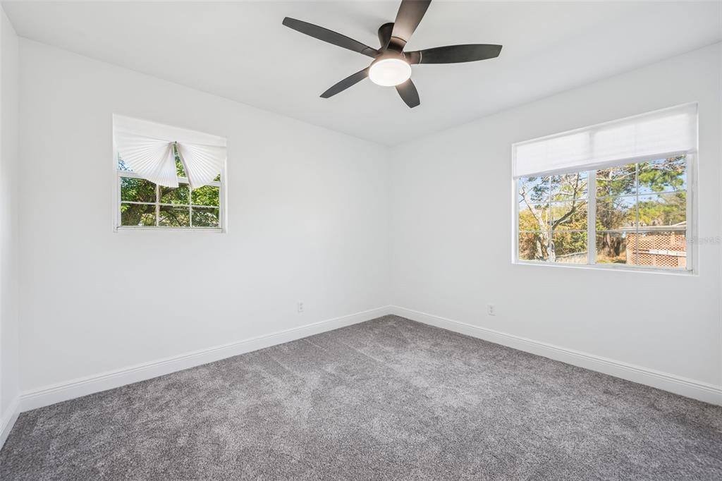 314 Wurst Road Ocoee, FL 34761 - Photo 18 of 35 an empty room with window and ceiling fan