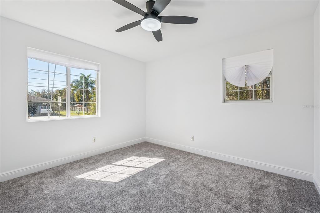 314 Wurst Road Ocoee, FL 34761 - Photo 22 of 35 an empty room with a window and ceiling fan