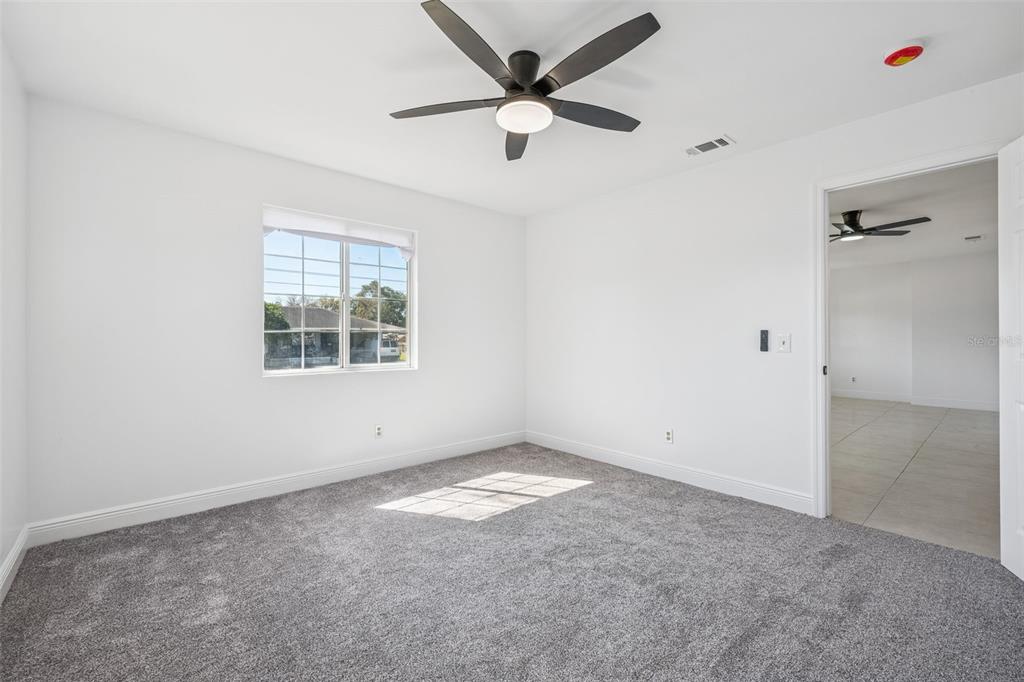 314 Wurst Road Ocoee, FL 34761 - Photo 23 of 35 an empty room with windows and fan