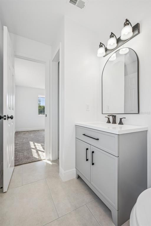 314 Wurst Road Ocoee, FL 34761 - Photo 25 of 35 a bathroom with a sink and a mirror