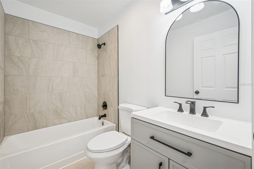 314 Wurst Road Ocoee, FL 34761 - Photo 28 of 35 a bathroom with a sink toilet and shower