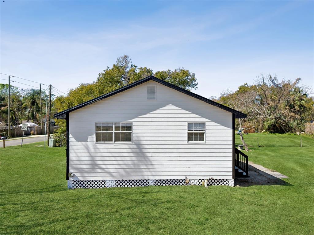 314 Wurst Road Ocoee, FL 34761 - Photo 31 of 35 a front view of a house with a yard