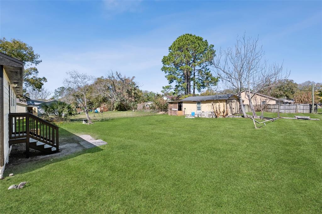 314 Wurst Road Ocoee, FL 34761 - Photo 33 of 35 a view of a garden with a bench in the garden
