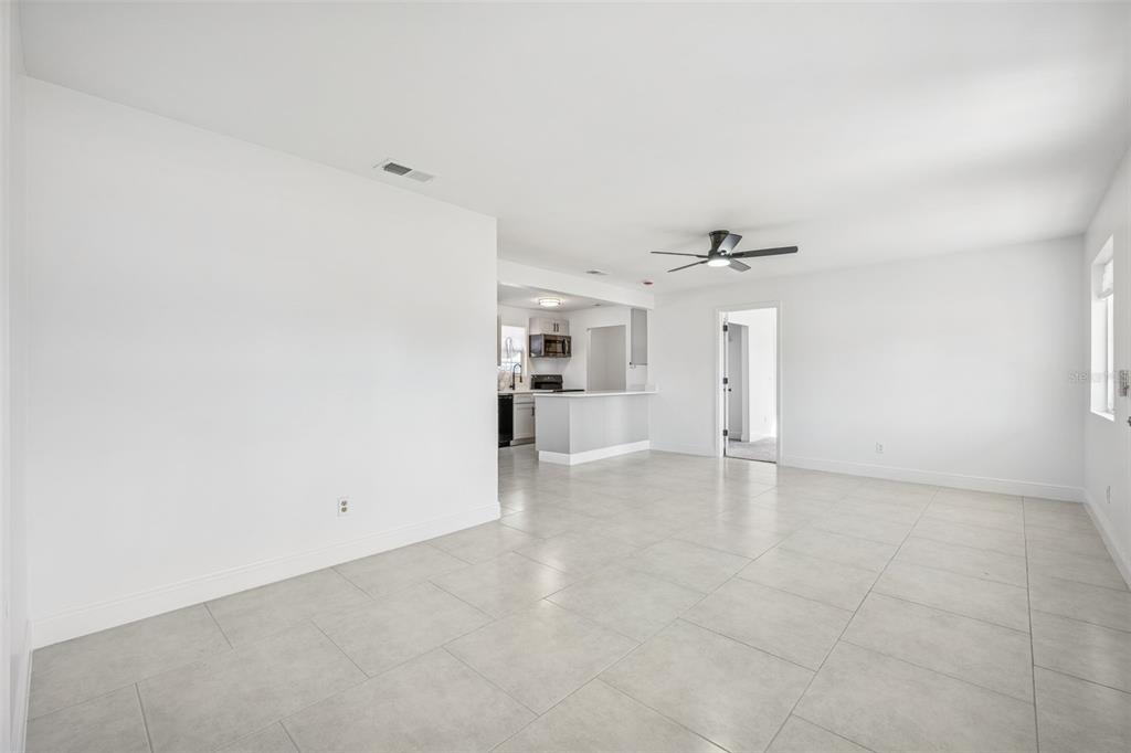 314 Wurst Road Ocoee, FL 34761 - Photo 10 of 35 an empty room with a kitchen and a sink