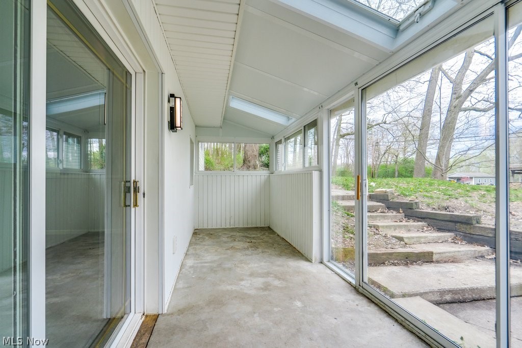 4596 Hattrick Road Rootstown, OH 44272 - Photo 45 of 45 Unfurnished sunroom with lofted ceiling with skylight