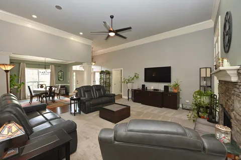 a view of a livingroom with furniture window and wooden floor