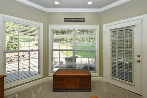 a bathroom with a granite countertop sink mirror and a bathtub