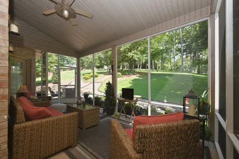 a view of a backyard with sitting area
