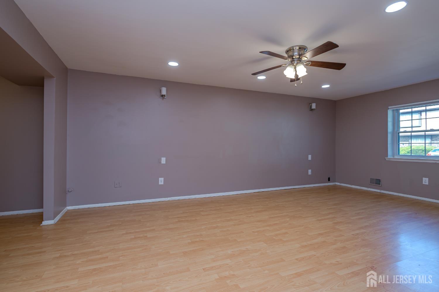 5601 Hana Road Edison, NJ 08817 - Photo 6 of 27 a view of an empty room with a window